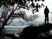 Man Standing by Falls