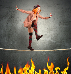 Clown on a tightrope over fire
