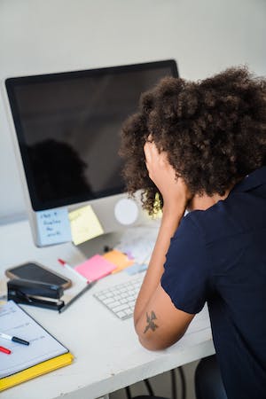 stressed-woman-desk image