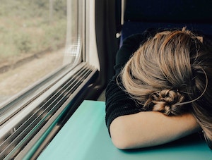 Woman Sleeps on Train